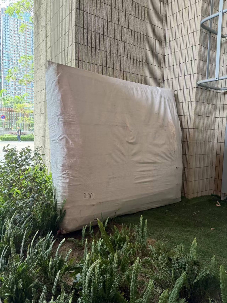 A HK$168,180 mattress, left in the street to weather the rain