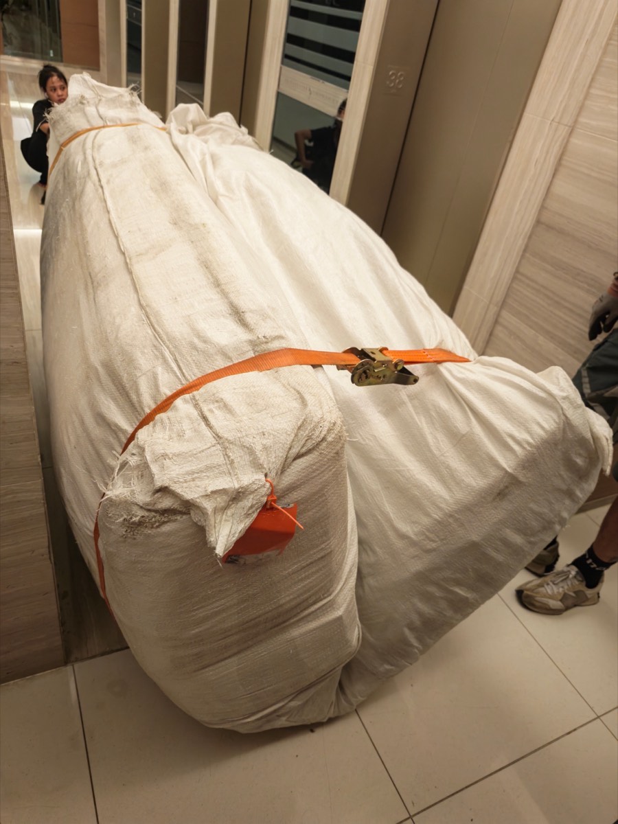Bending the mattress double with a strap